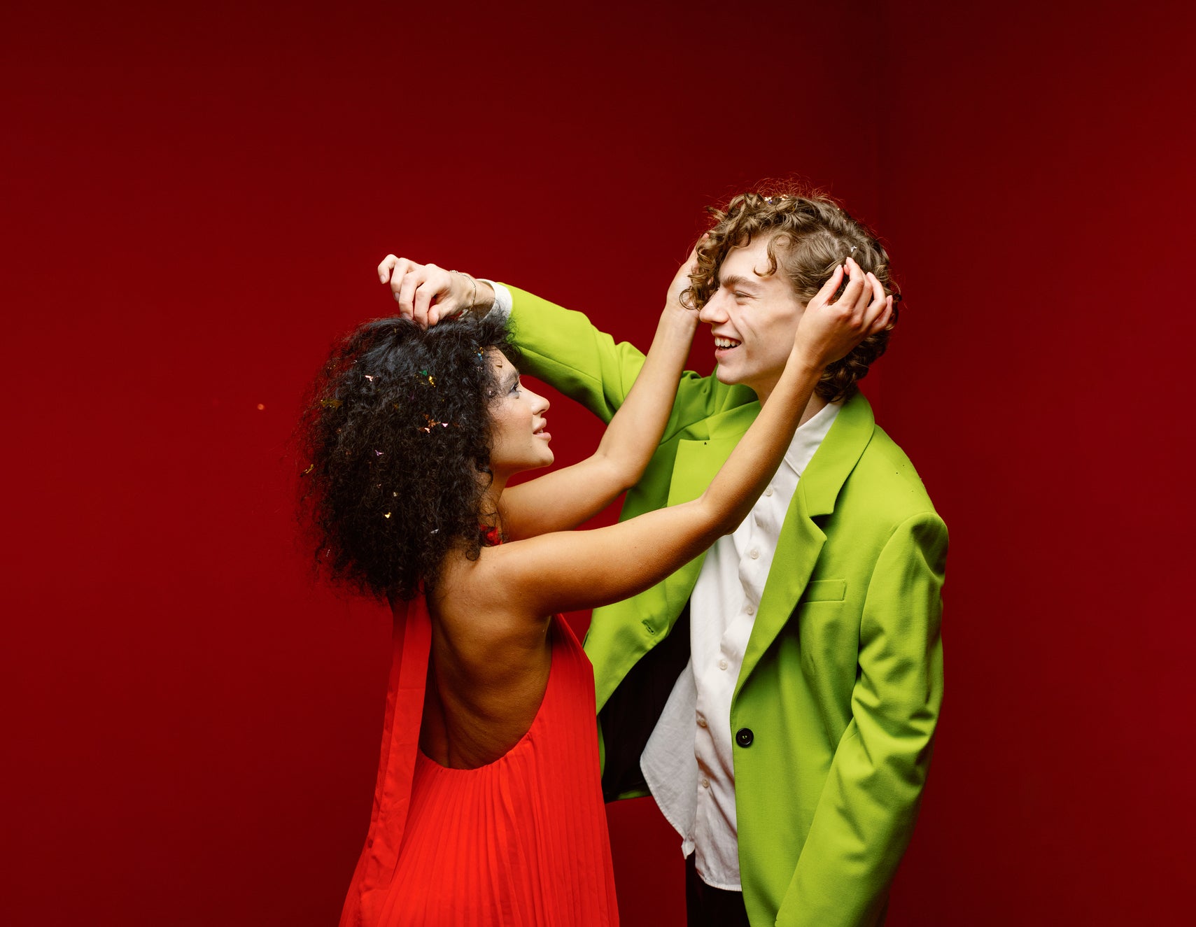 People touching each other's hair