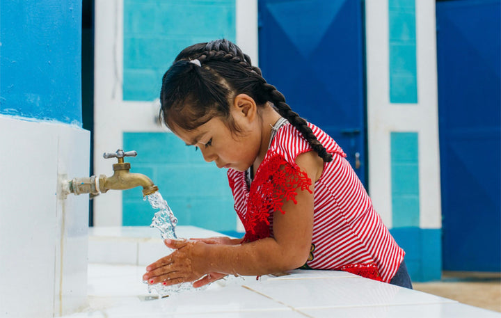 Girl Washing Hands over sink