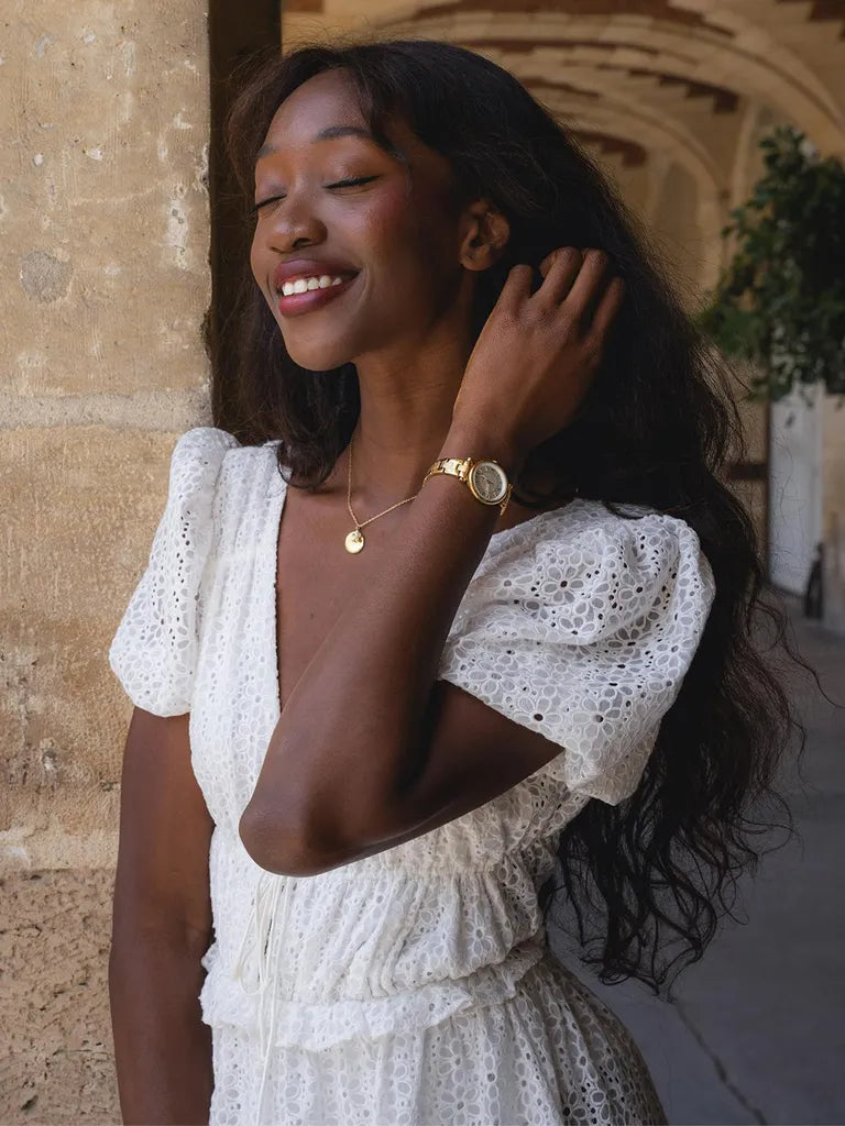 Girl smiling with hand in hair