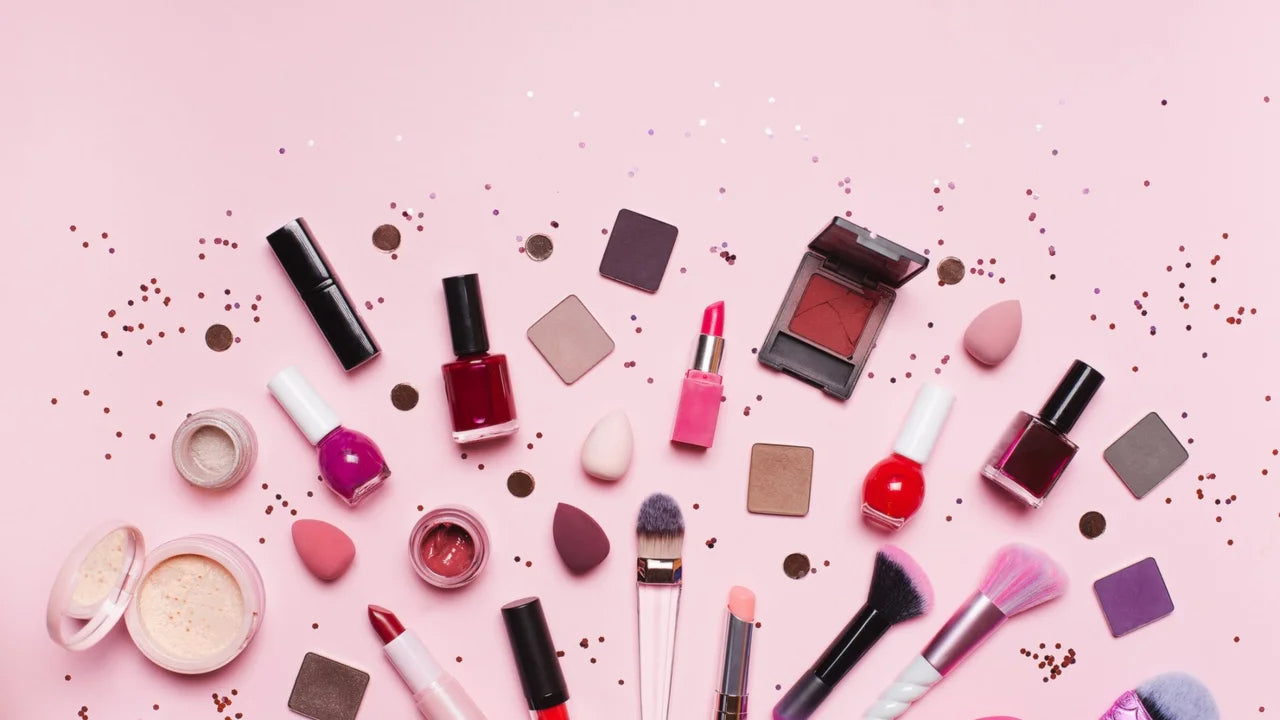 Cosmetic products on pink background from Essence