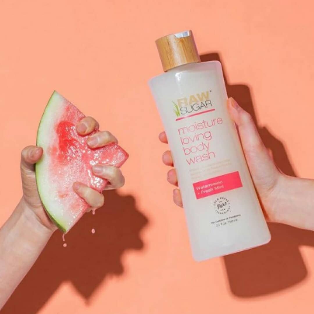 Watermelon in left hand Raw Sugar Moisture Loving Watermelon + Fresh Mint Body Wash in right hand