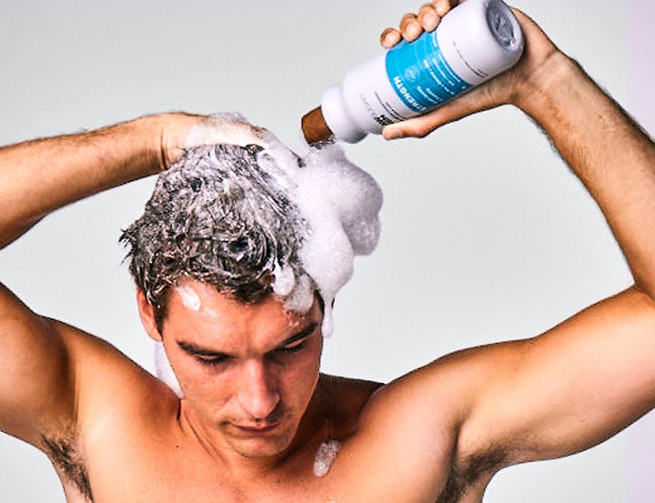 guy shampooing with raw sugar shampoo conditioner men
