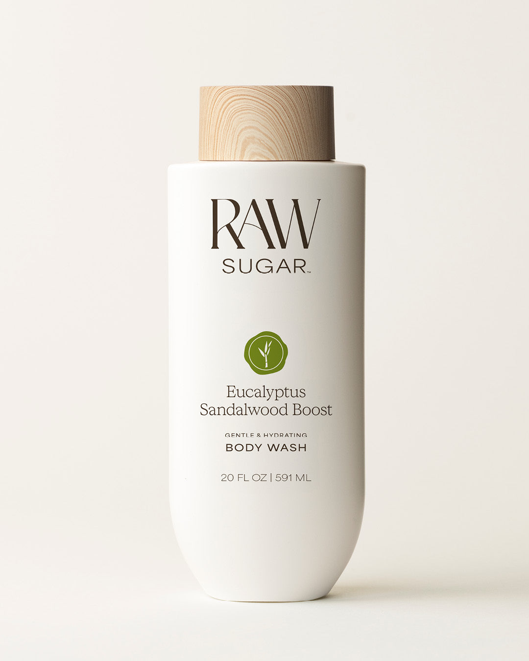 Bottle of Raw Sugar Eucalyptus Body Wash on a cream background, designed to help gently cleanse and hydrate skin with clean ingredients.