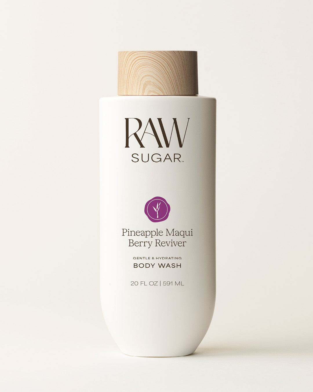 Bottle of Raw Sugar Pineapple Body Wash on a cream background, designed to help gently cleanse and hydrate skin with clean ingredients.