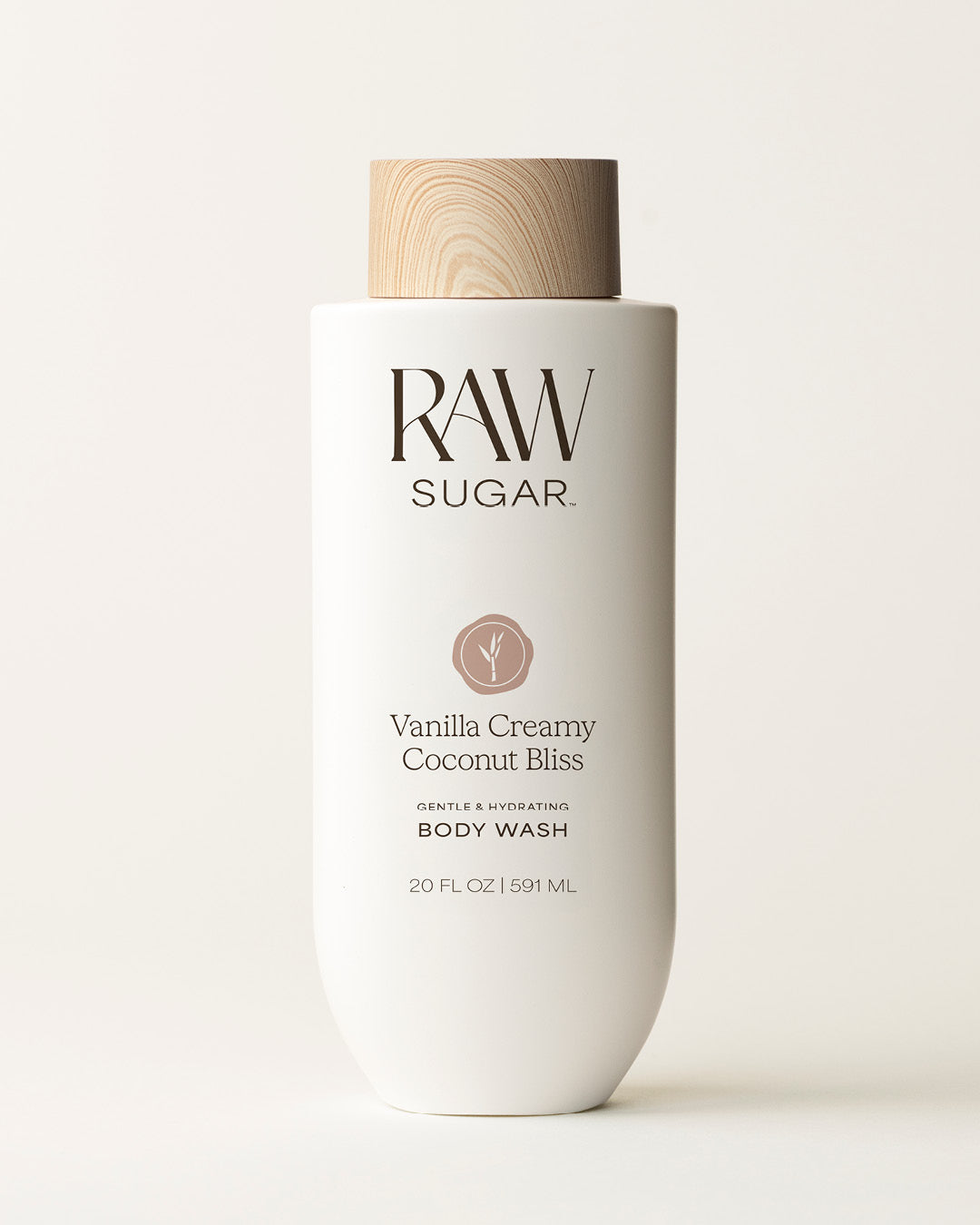 Bottle of Raw Sugar Vanilla Body Wash on a cream background, designed to help gently cleanse and hydrate skin with clean ingredients.