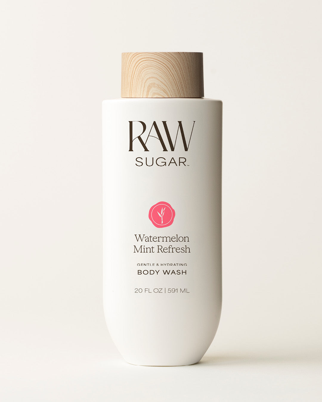 Bottle of Raw Sugar Watermelon Body Wash on a cream background, designed to help gently cleanse and hydrate skin with clean ingredients.