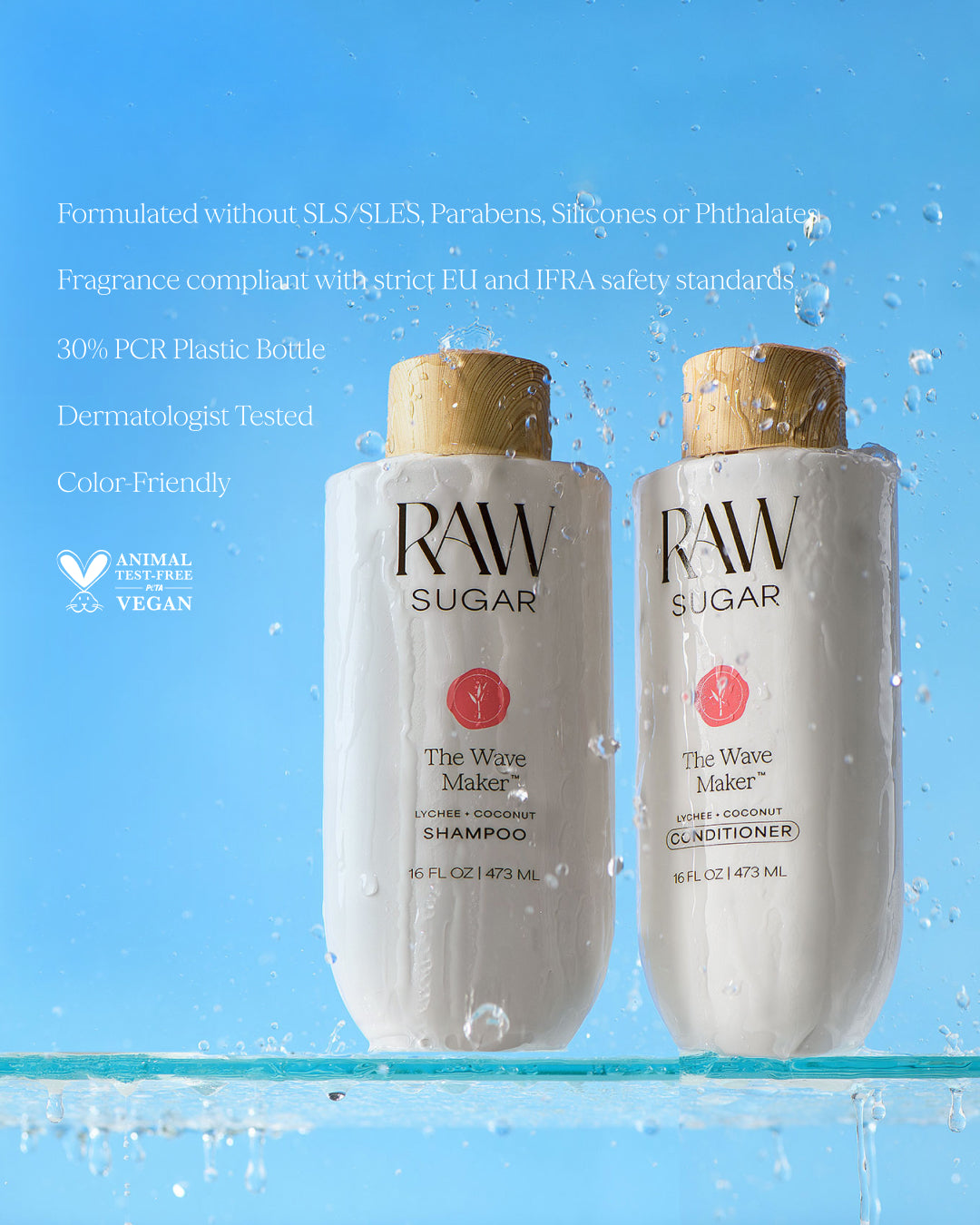 Two bottles of Raw Sugar shampoo and conditioner on a blue background with water droplets.