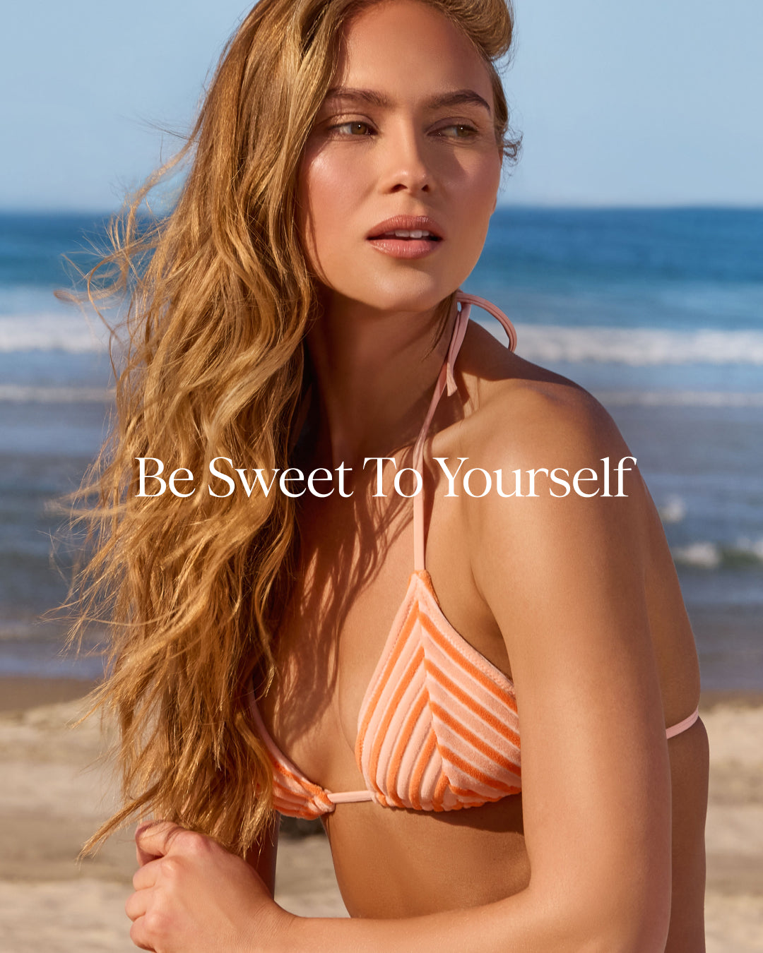 Woman in a striped bikini on a beach with 'Be Sweet To Yourself' text overlay