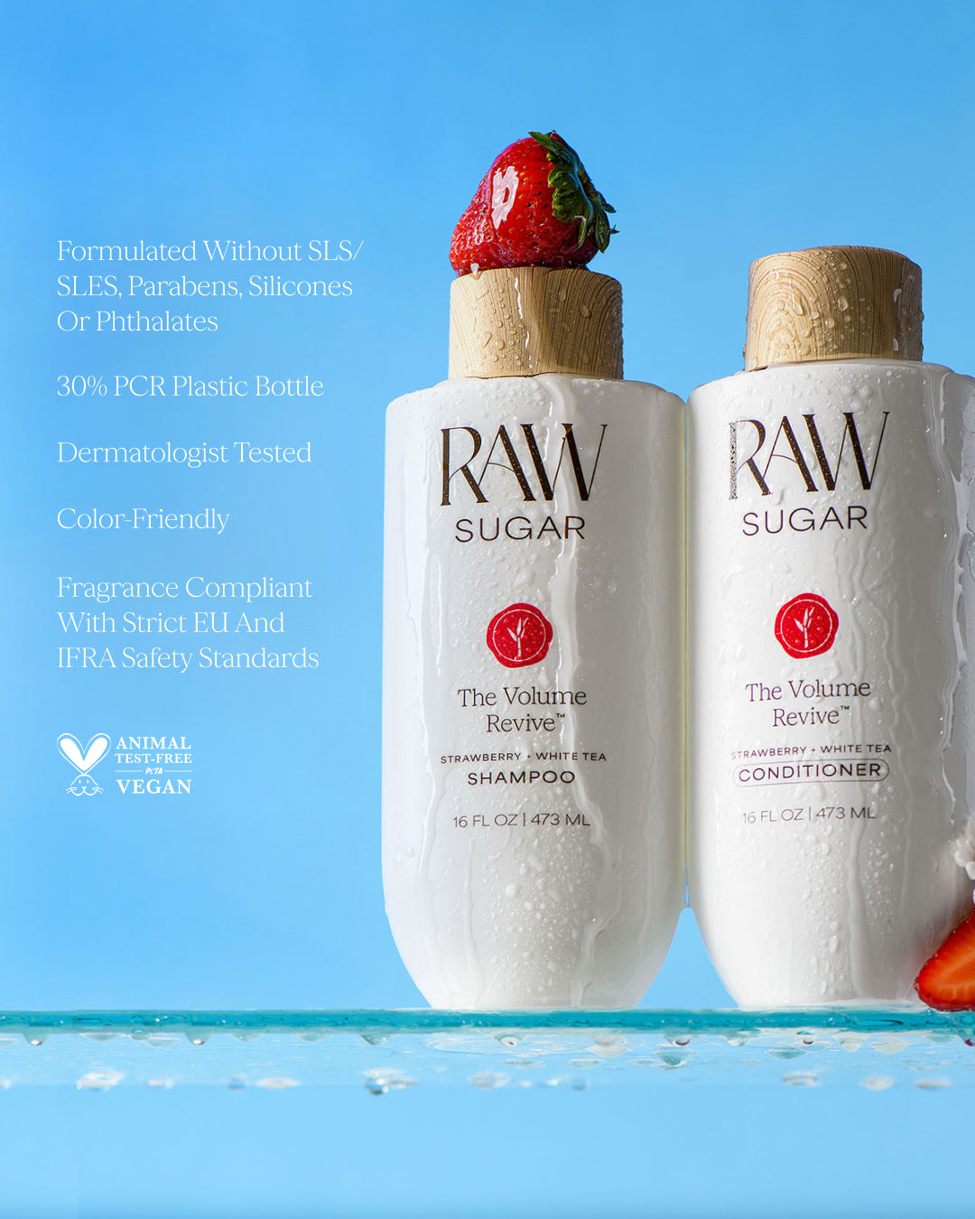 Two bottles of RAW Sugar shampoo and conditioner with strawberry flavor on a blue background