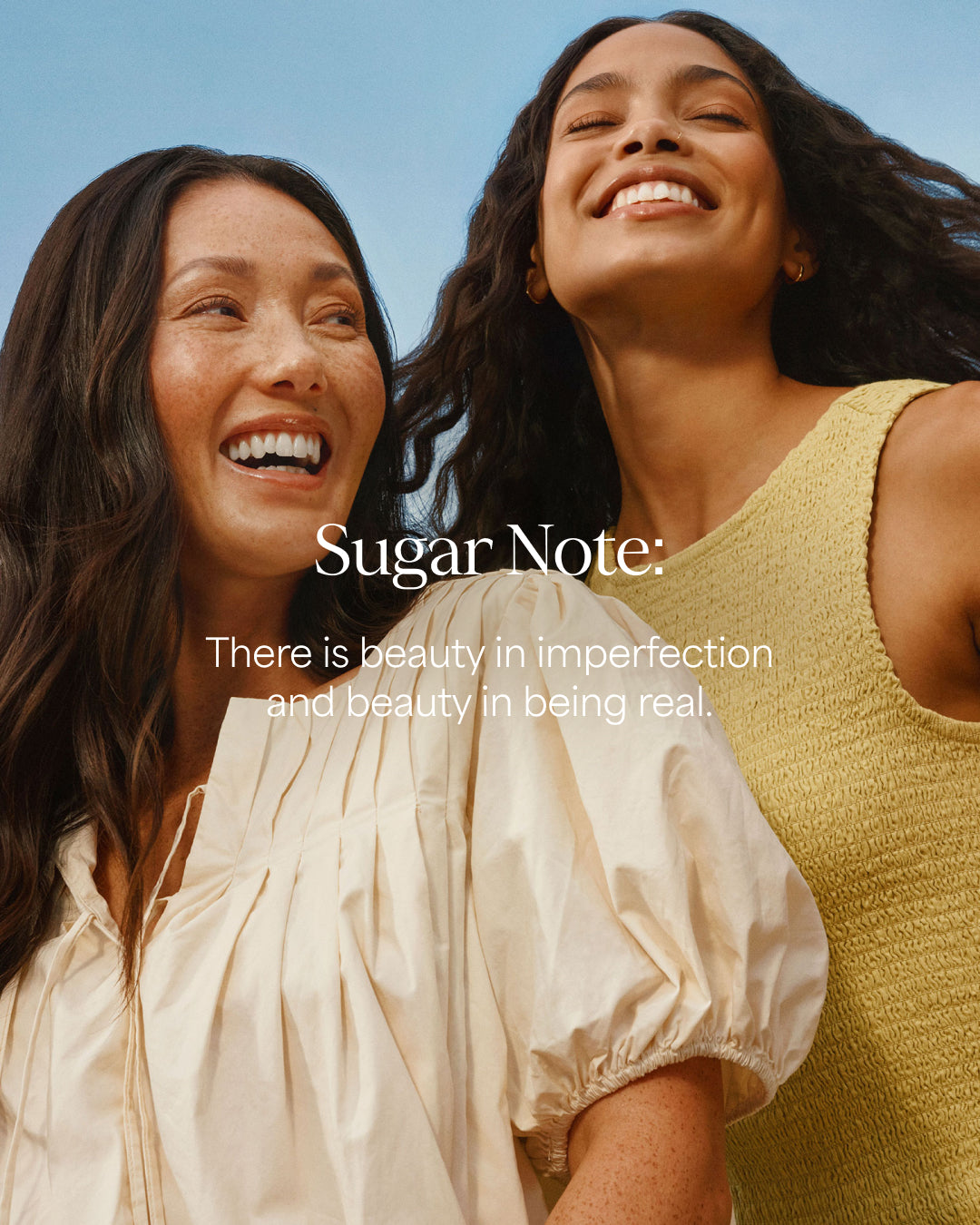 Two women smiling with a clear blue sky in the background, featuring the 'Sugar Note' brand.