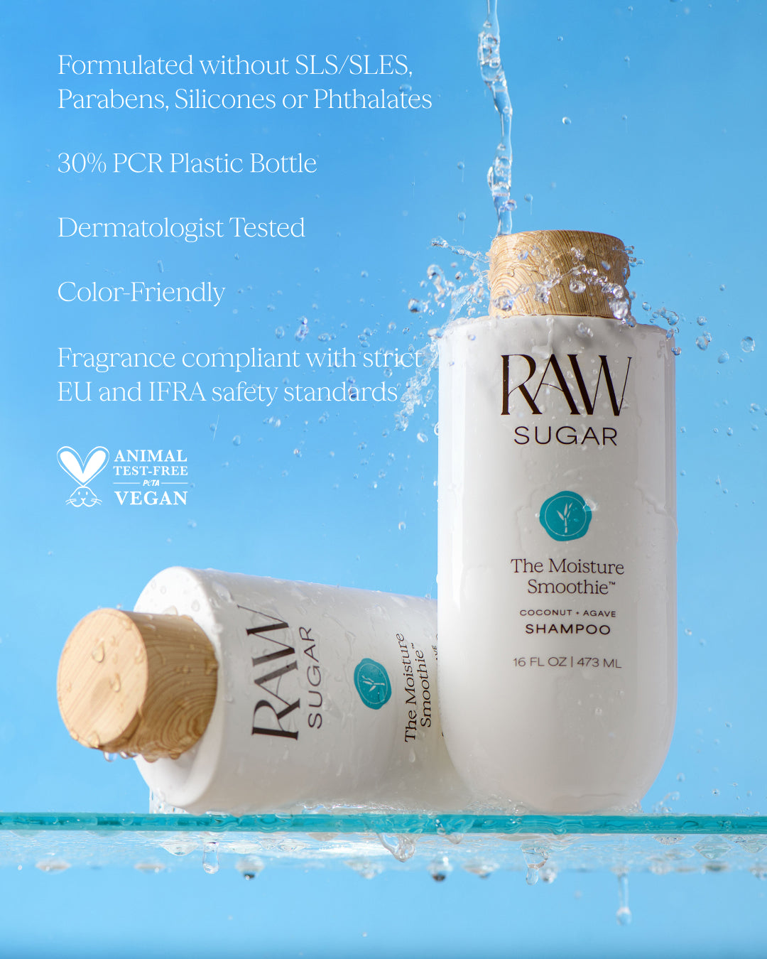 Two bottles of Raw Sugar Moisture Smoothie shampoo with water splashes on a blue background, designed to help moisturize hair with clean ingredients.