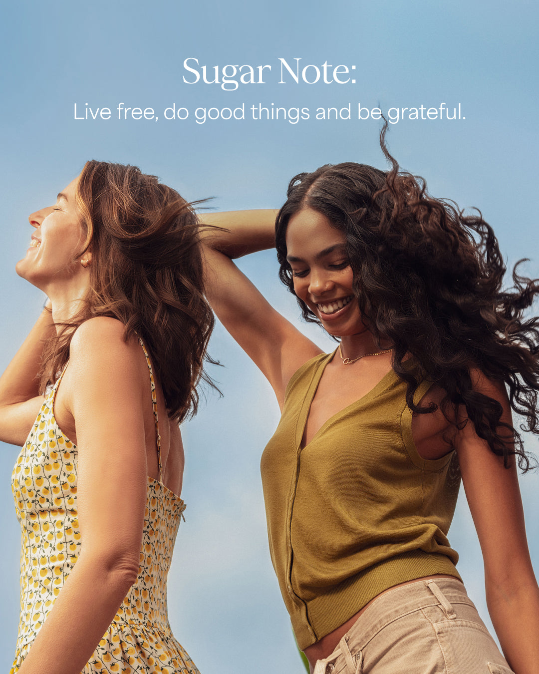 Two women standing outdoors with a clear blue sky, featuring the 'Sugar Note' brand message.