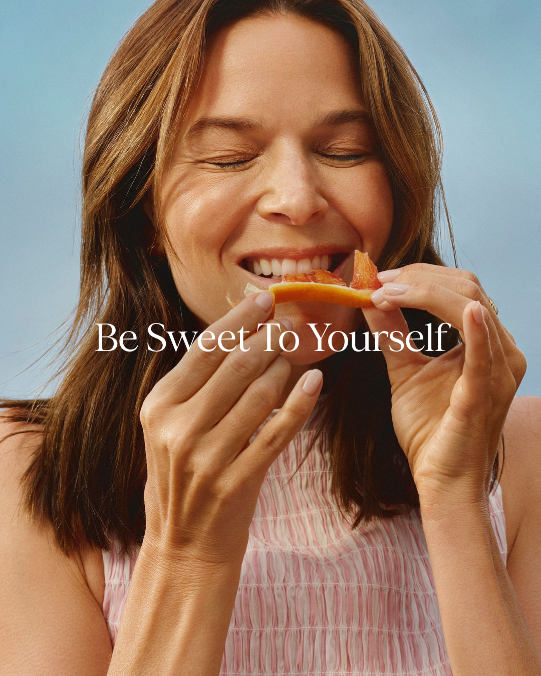 Woman eating a piece of fruit with 'Be Sweet To Yourself' text overlay.