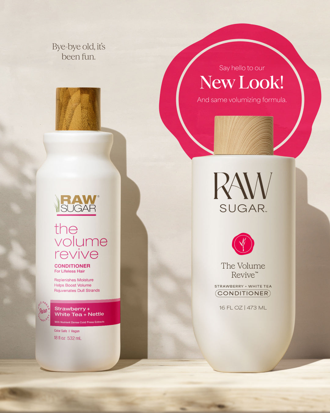 Two bottles of RAW Sugar 'The Volume Revive' conditioner on a wooden surface with a pink circular sign above them.