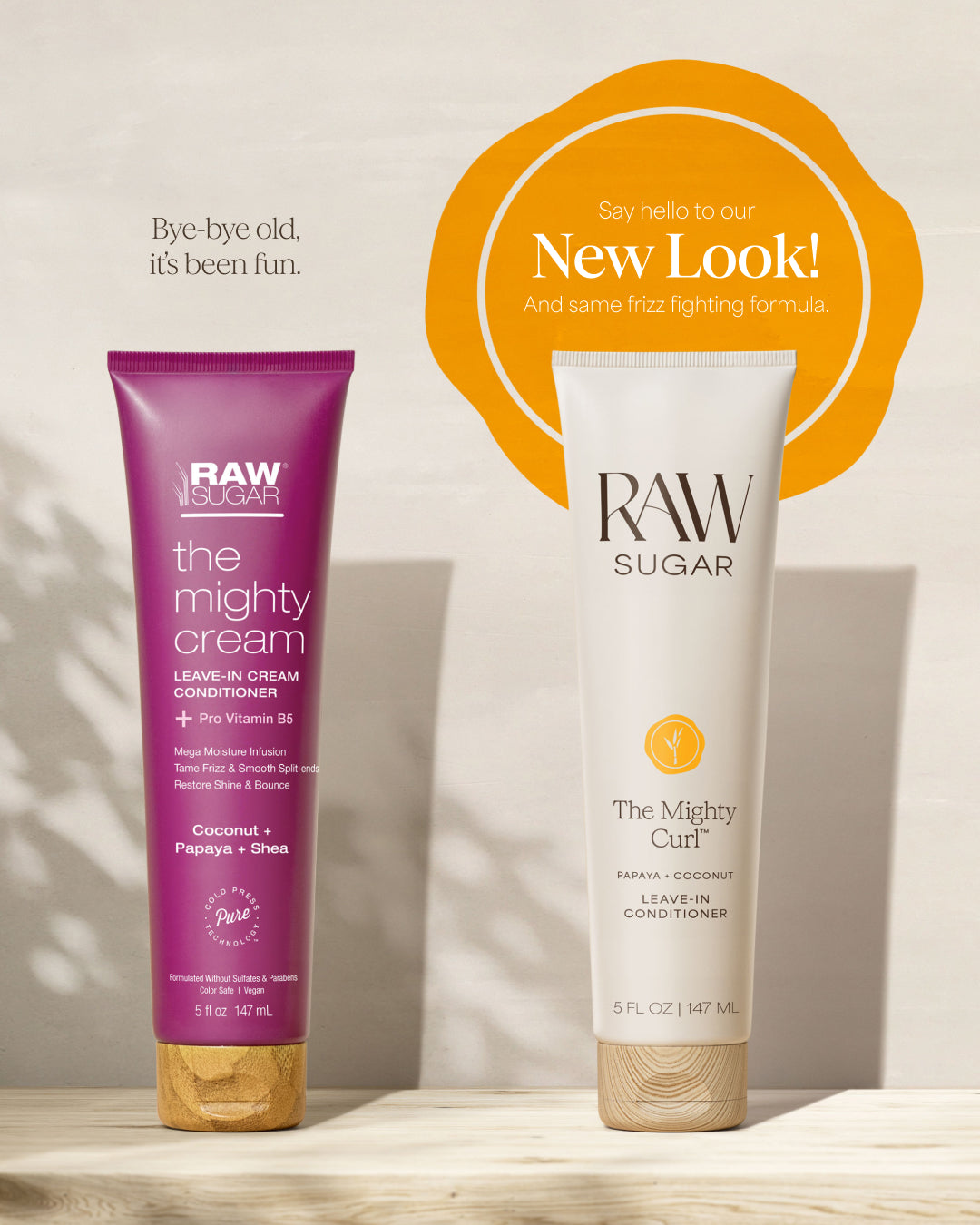 Two Raw Sugar hair care curl products on a wooden surface with a 'New Look' banner.