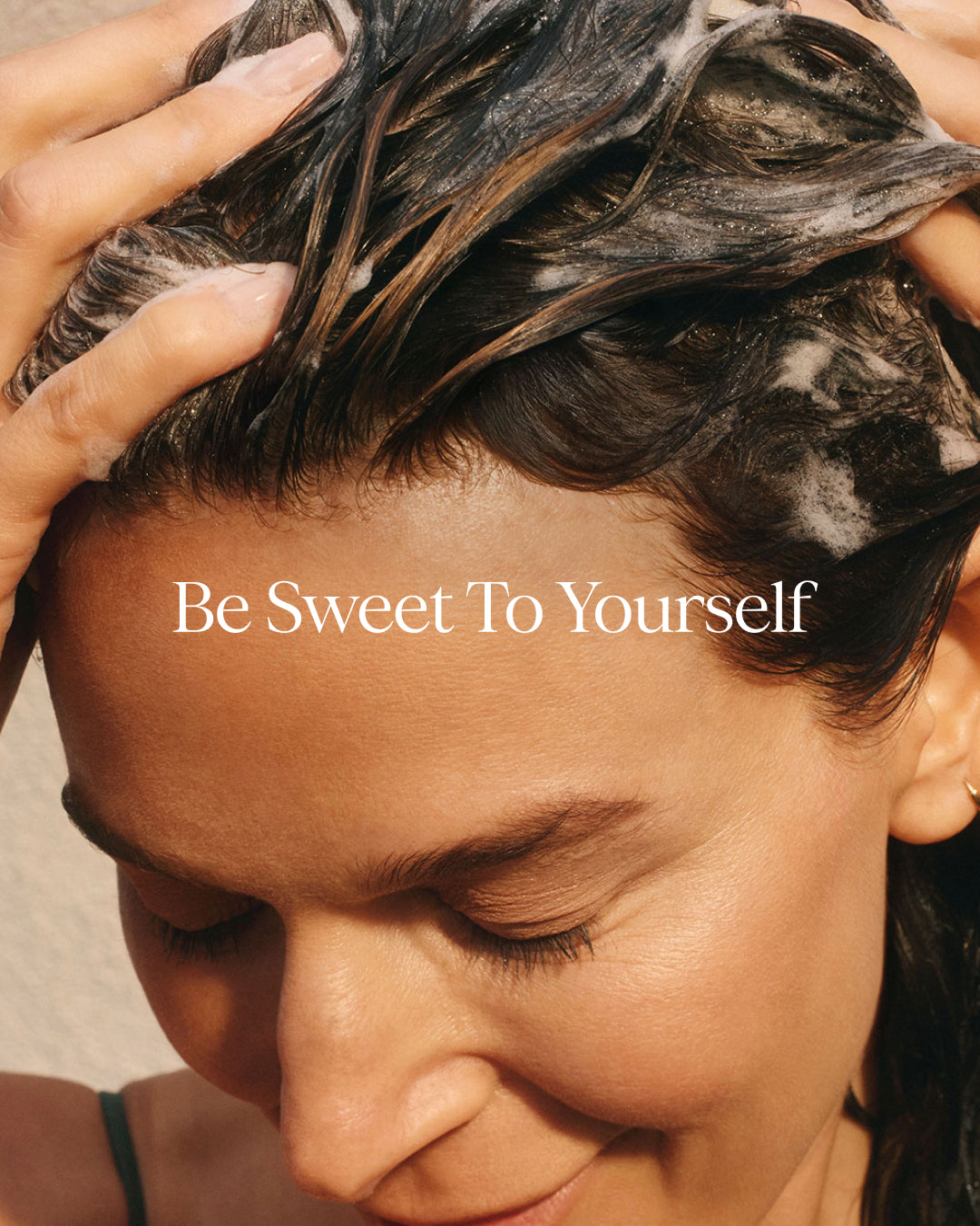 Person with wet hair being styled, with text 'Be Sweet To Yourself' on a neutral background