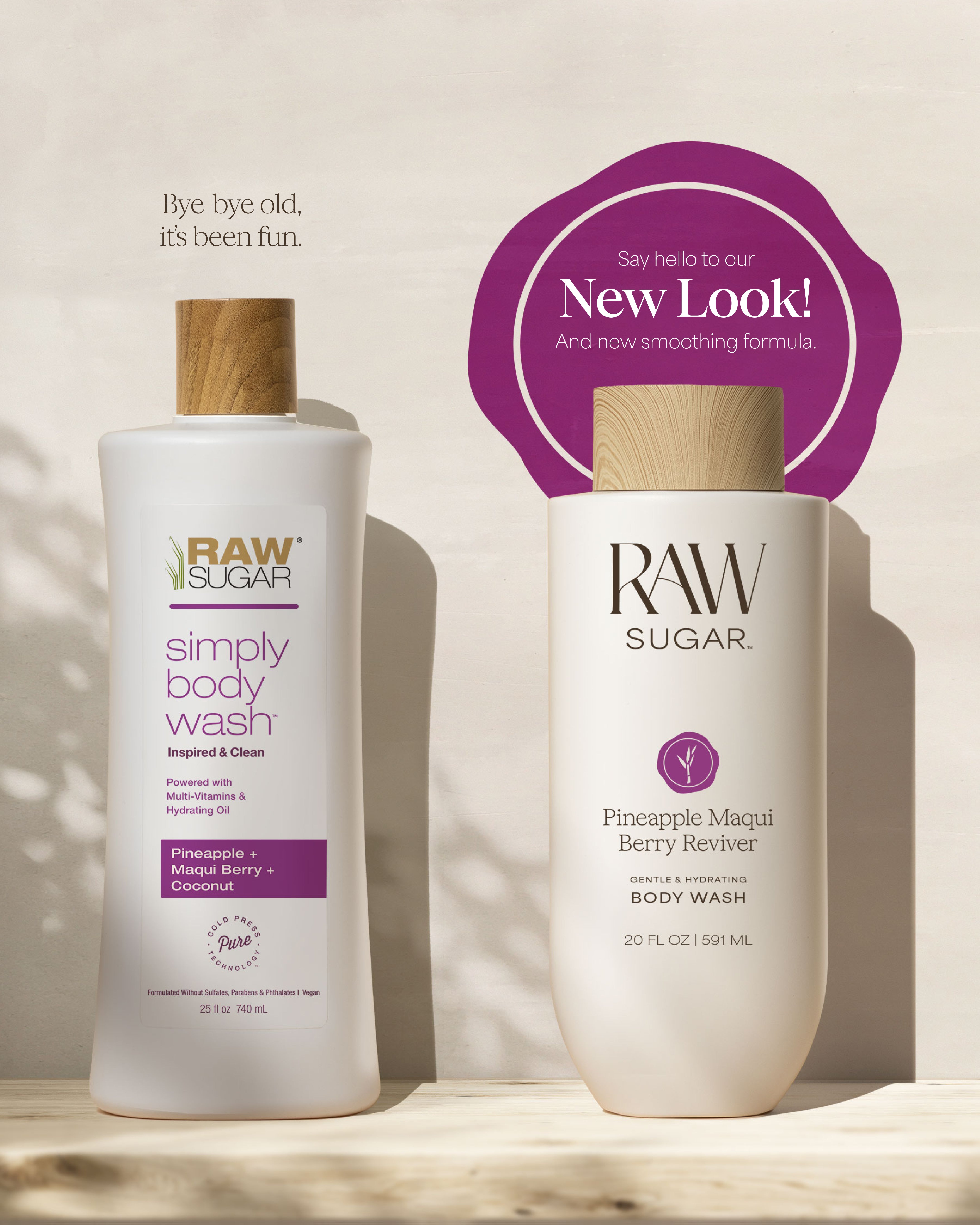 Two bottles of Raw Sugar body wash with a purple label on a neutral background, designed to help gently cleanse and hydrate skin with clean ingredients.