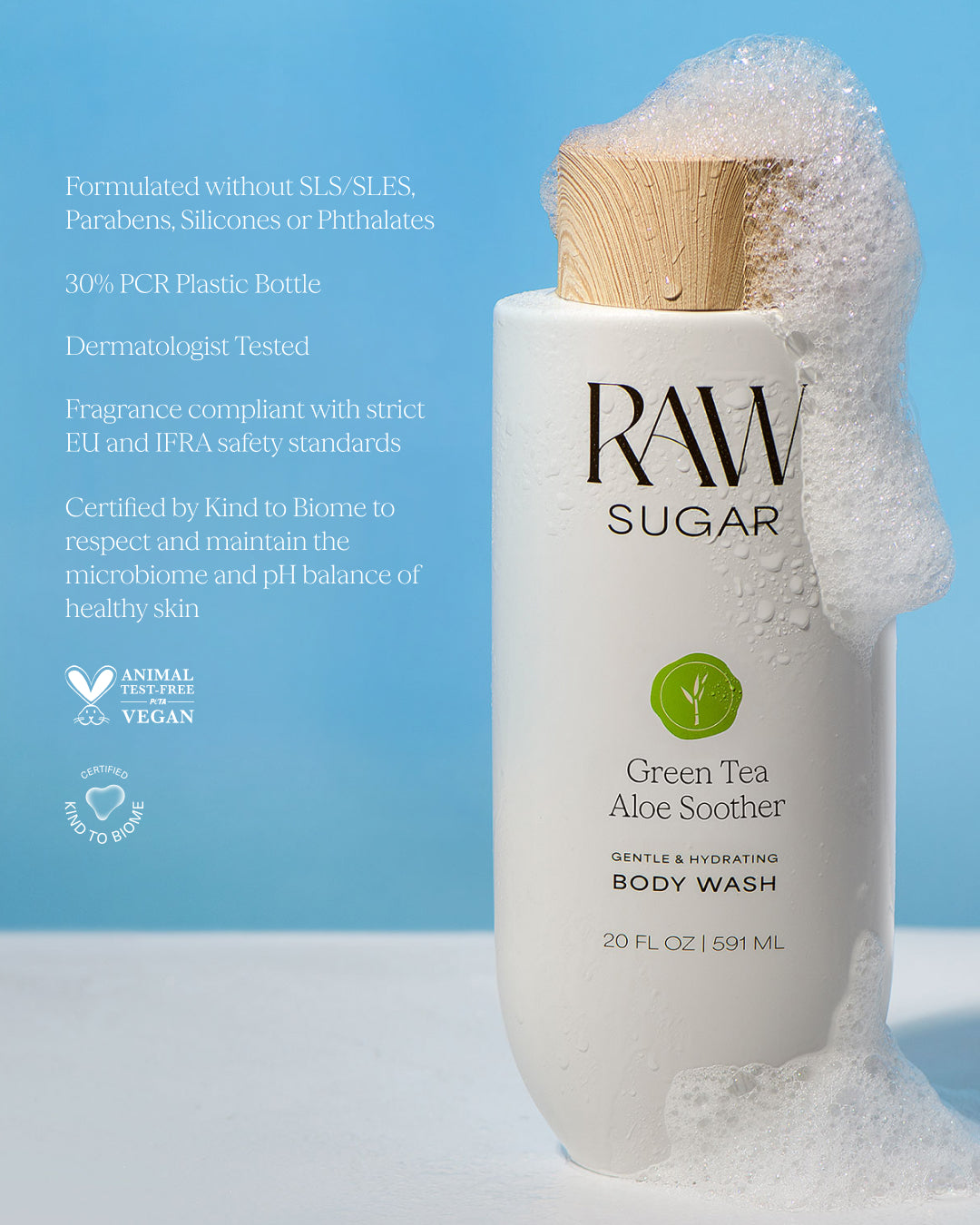 RAW Sugar Green Tea Aloe Soother body wash with a wooden pump on a blue background designed to help gently cleanse and hydrate skin with clean ingredients.