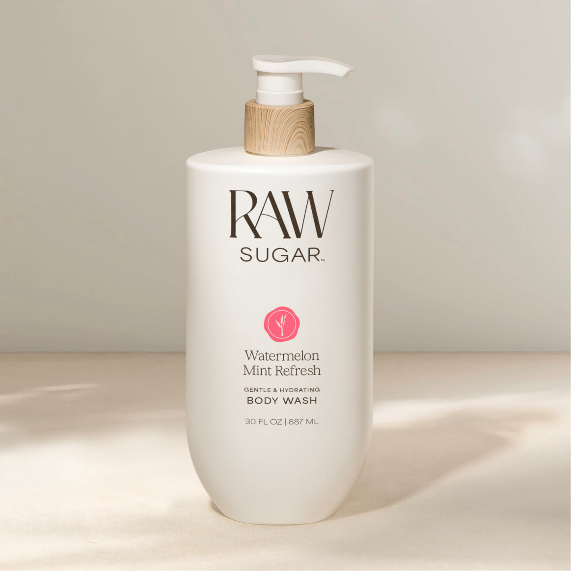 RAW SUGAR body wash bottle on a neutral background