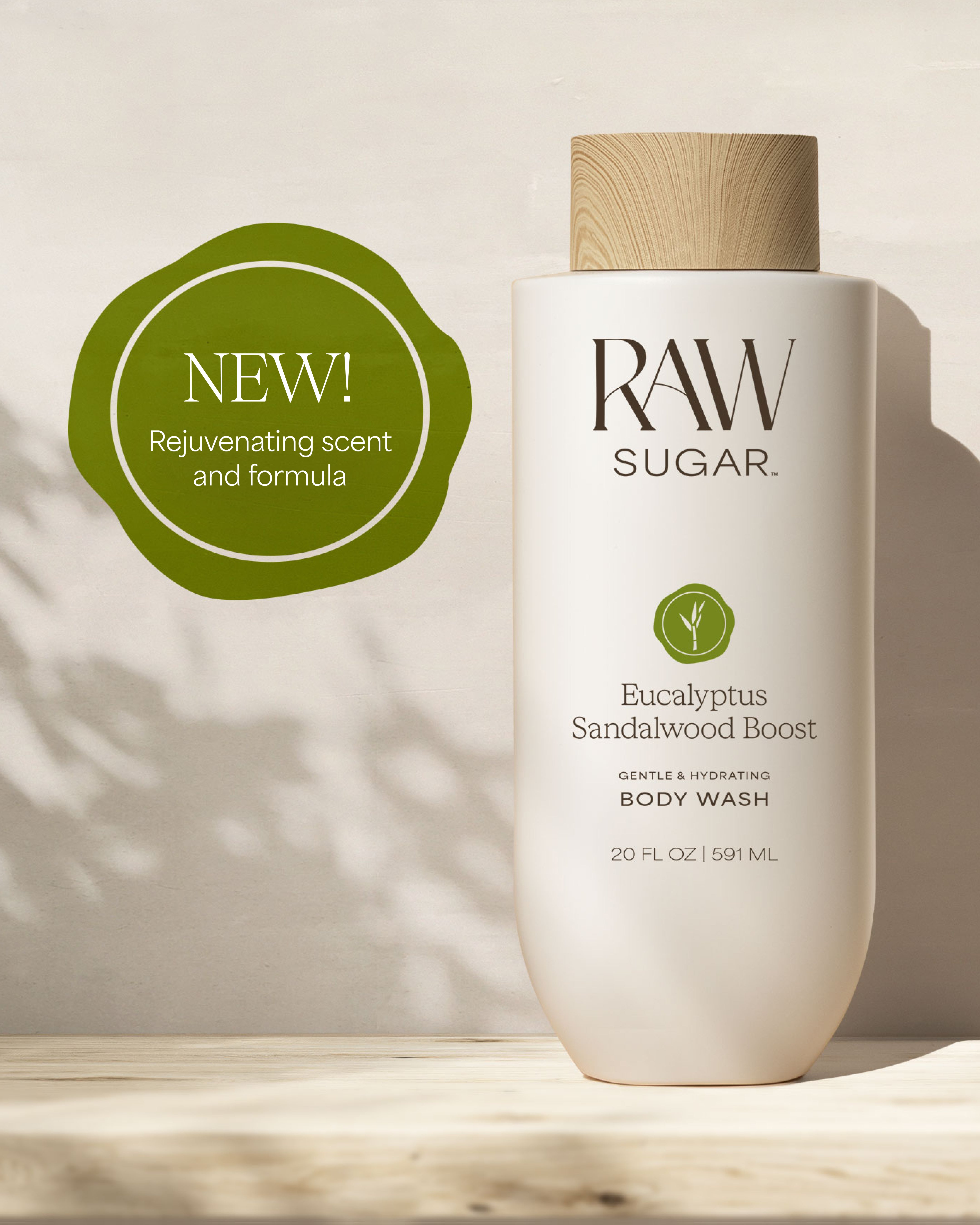 RAW Sugar body wash bottle with a green 'NEW!' label on a neutral background