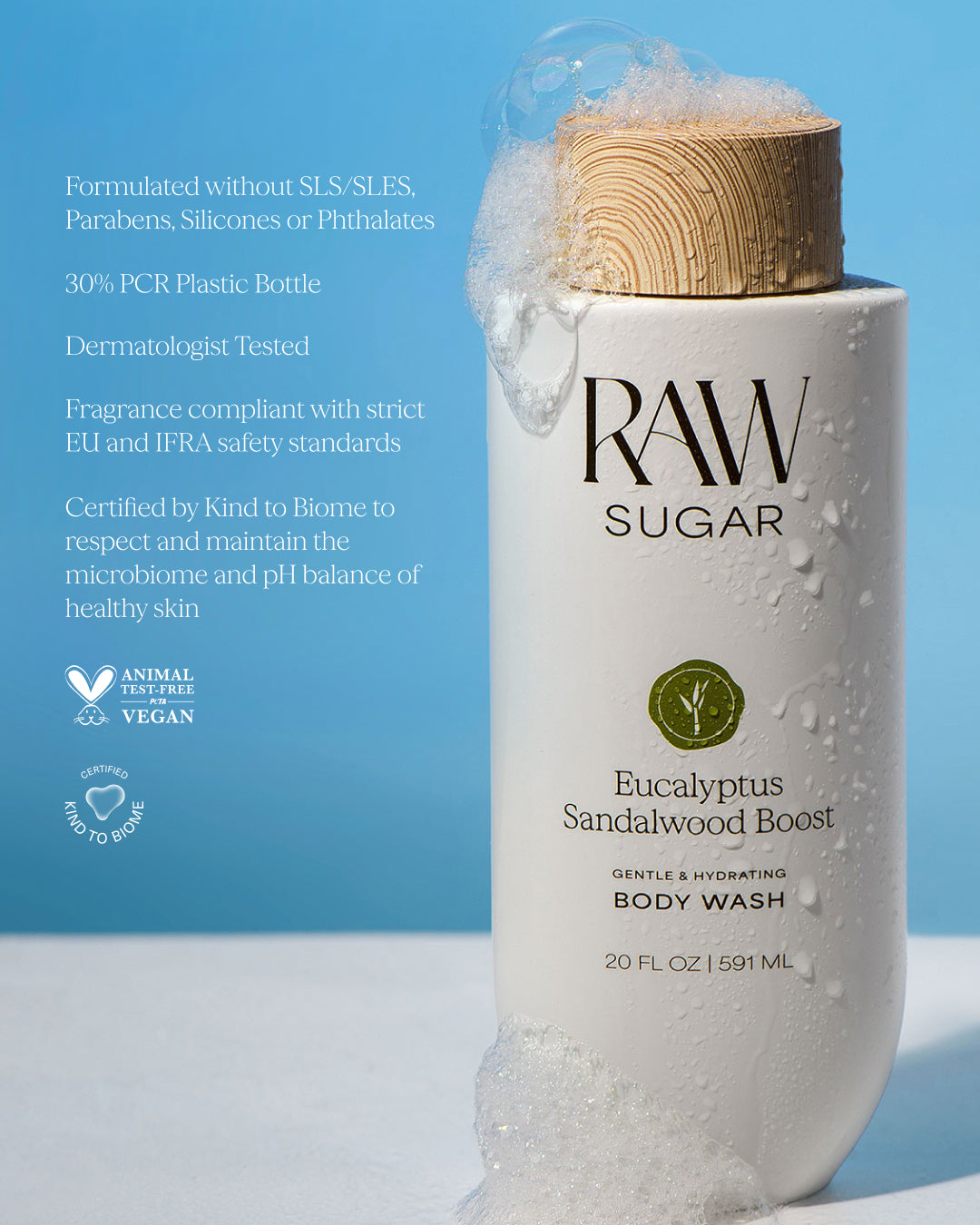 RAW Sugar body wash bottle with bamboo cap on a blue background