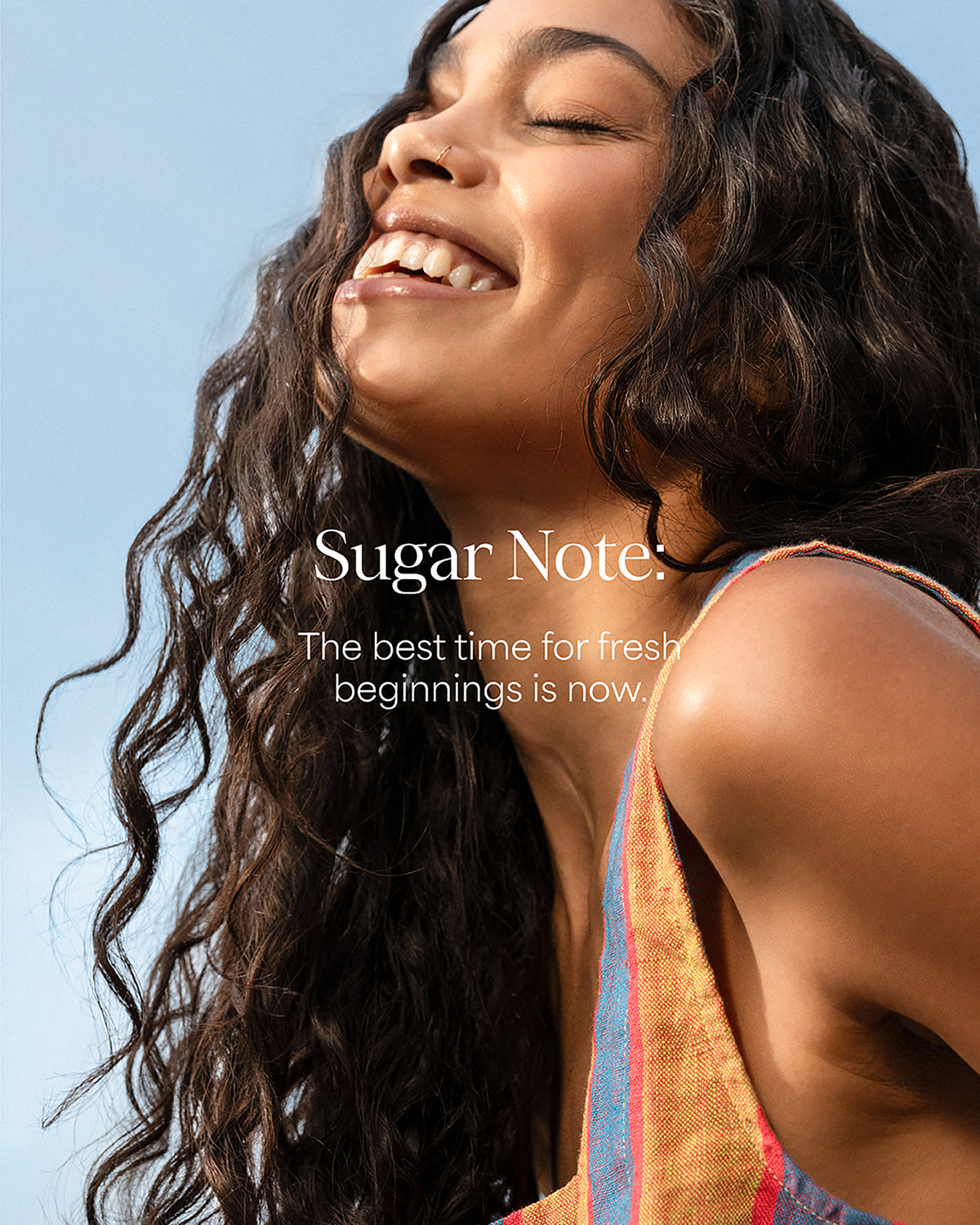 Woman with long hair against a blue sky, featuring 'Sugar Note' branding.
