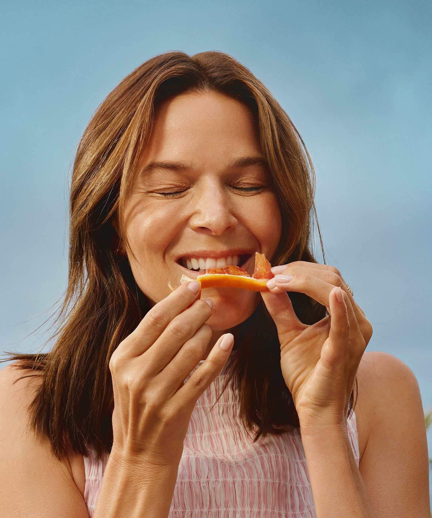 woman eating fruit