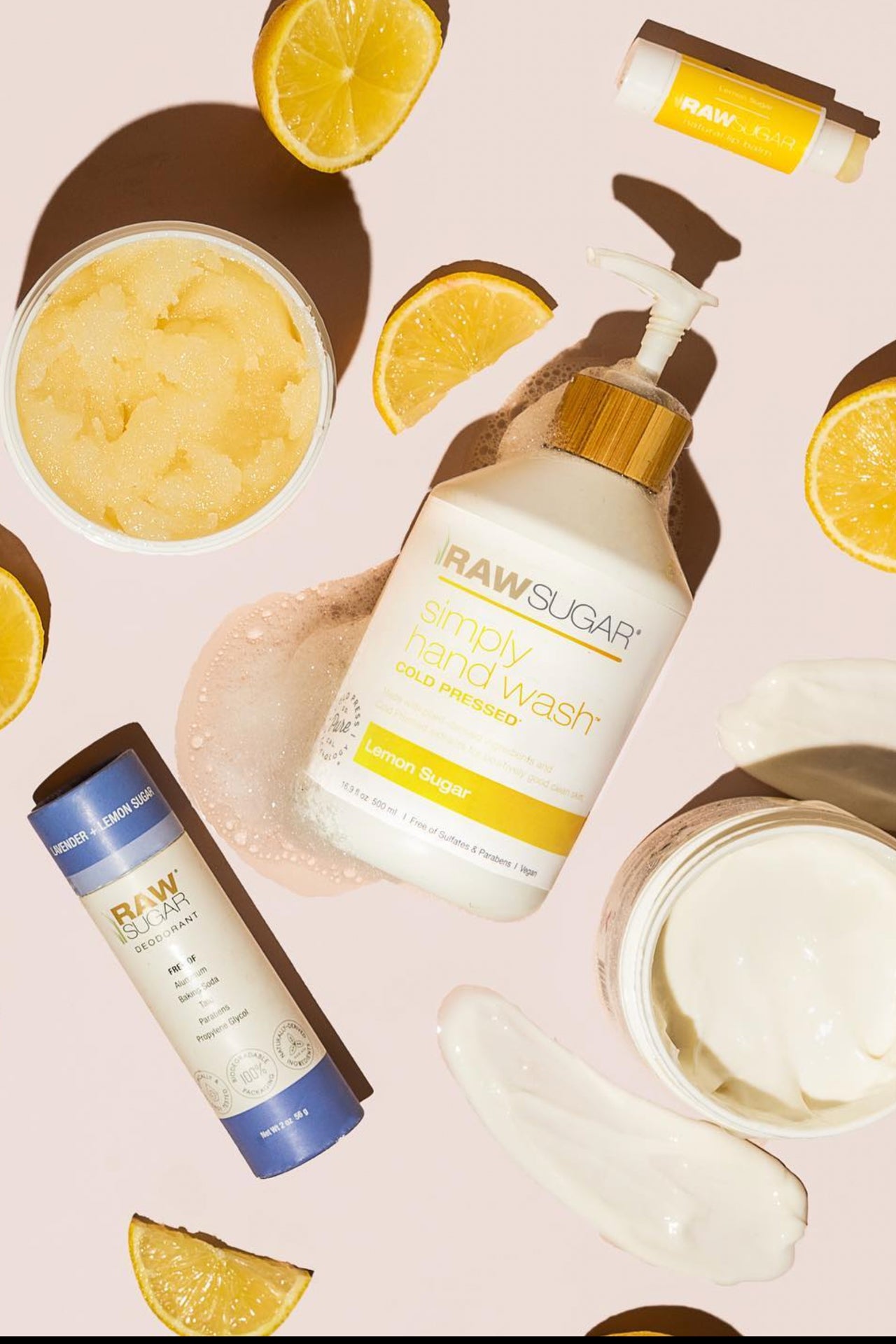 Raw Sugar group shot of Hand Wash, Deo, Lip Balm, Scrub, and Body Butter