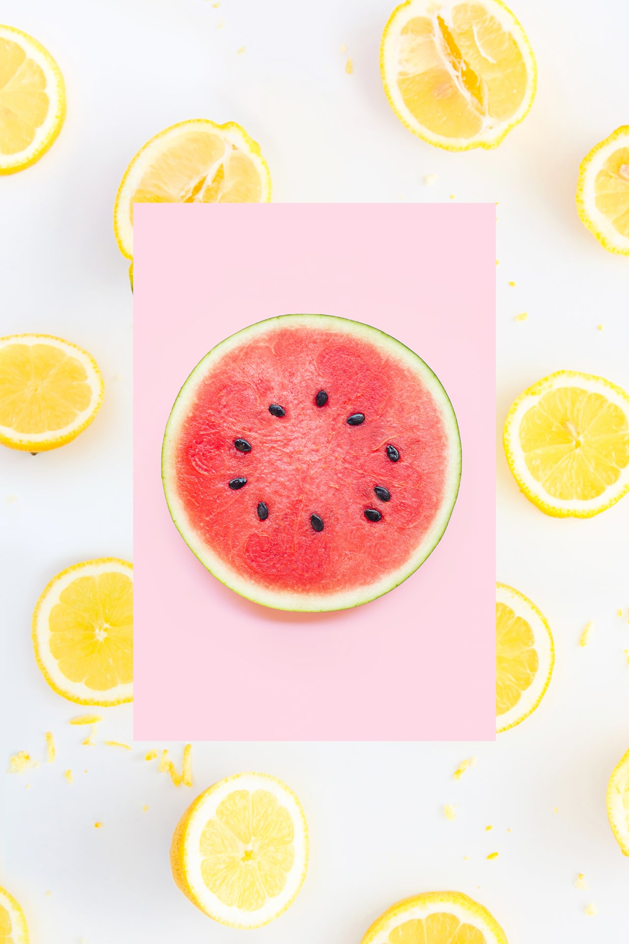 Perfect circle of a fresh watermelon slice with fresh lemon slices