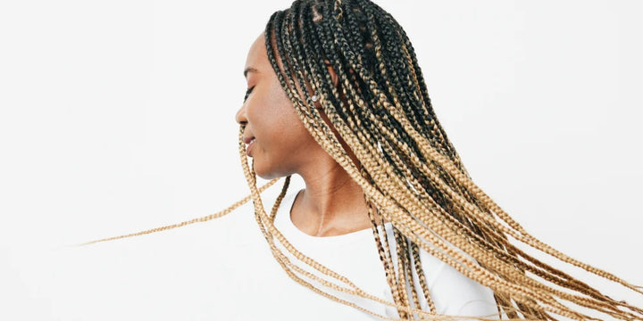 Woman with braids turning her head