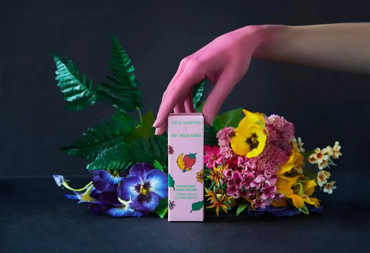 Hand holding products with flowers