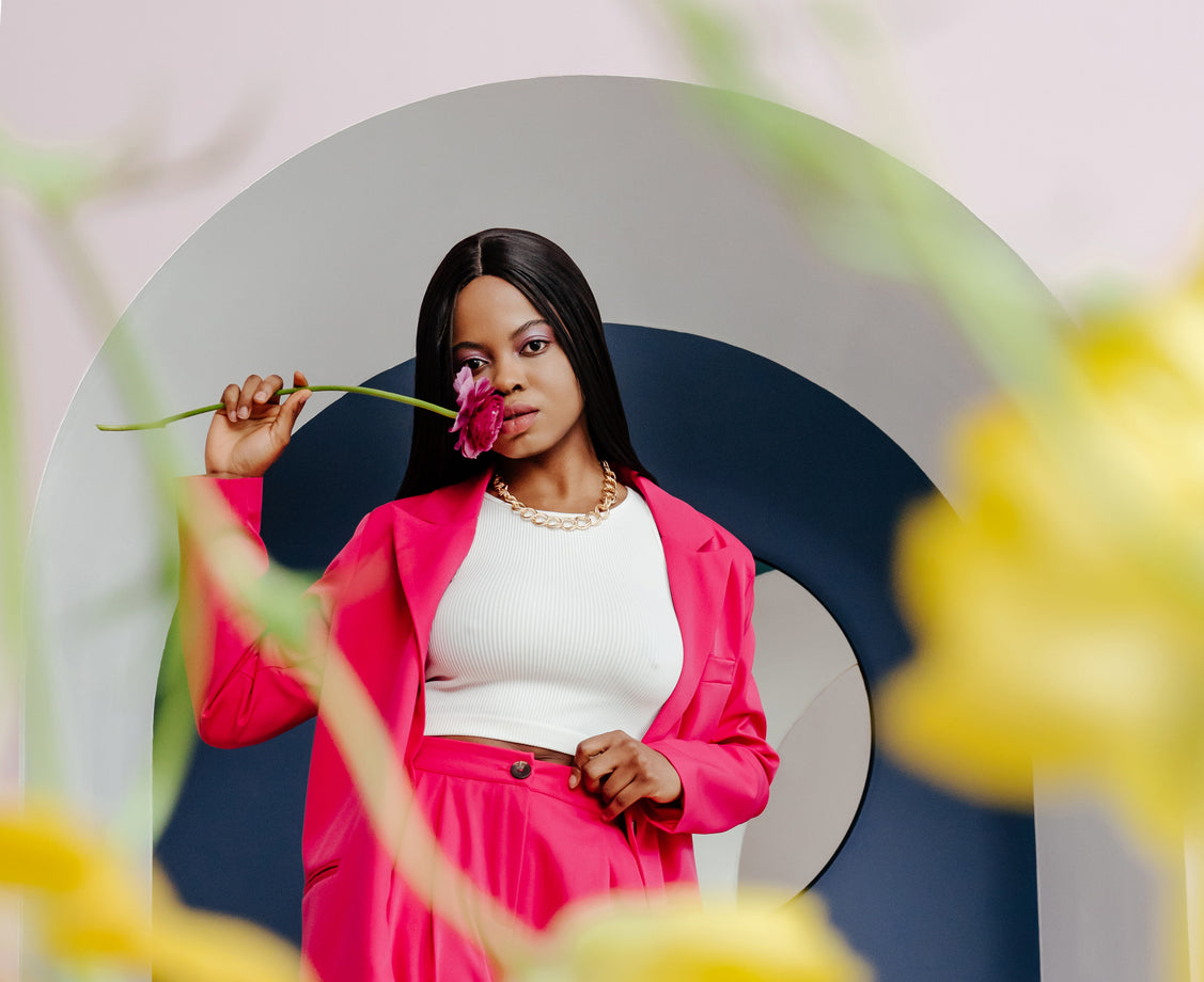 Woman with rose wearing bright colors