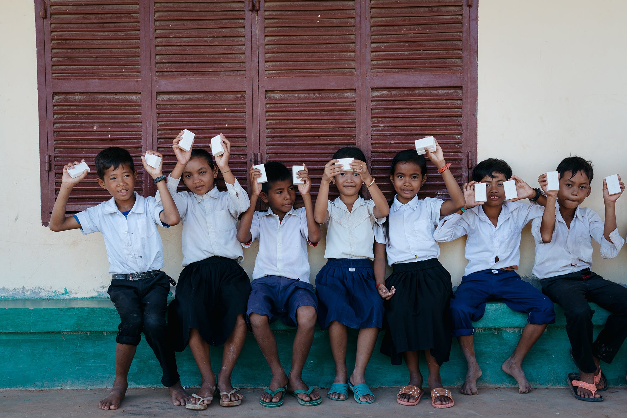 image of kids holding soap boxes