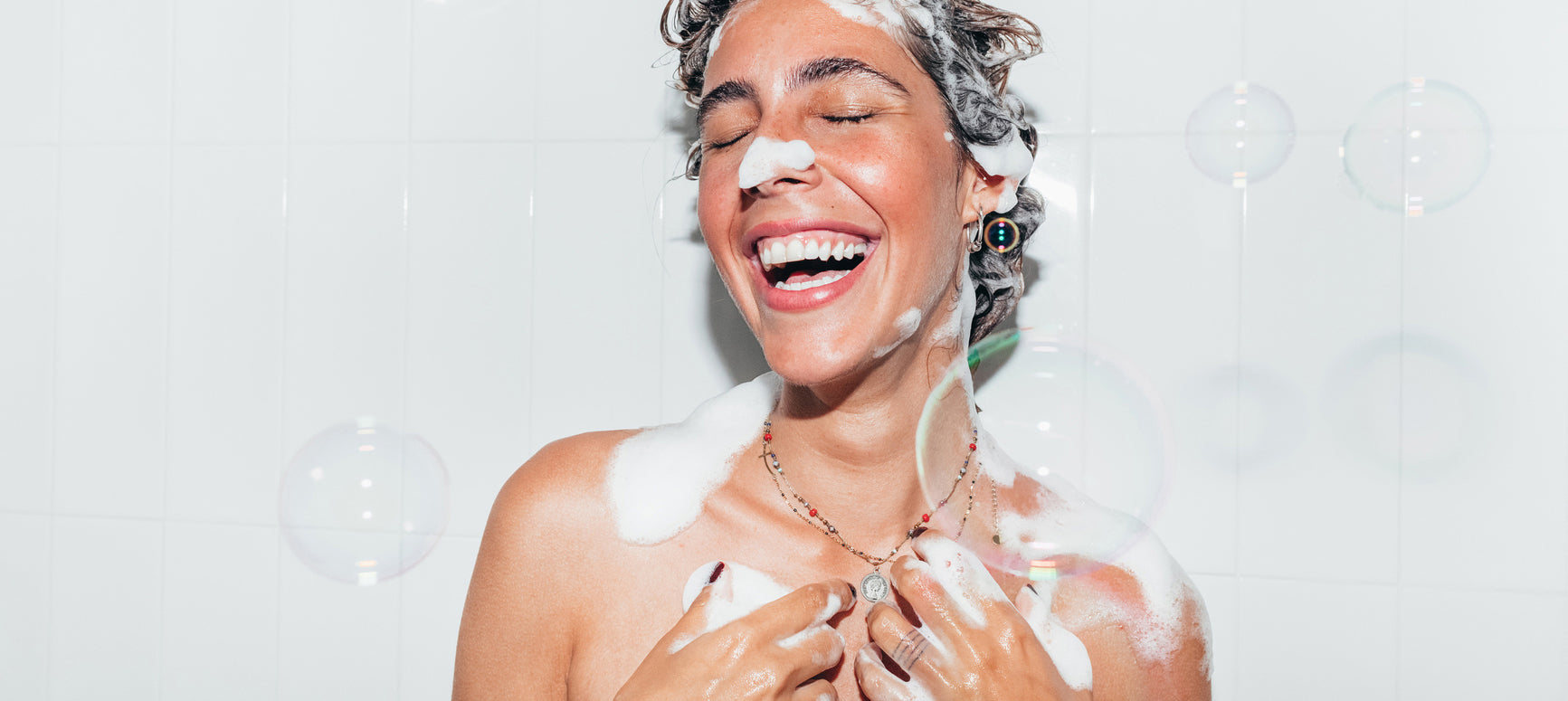 woman lathering up soap suds