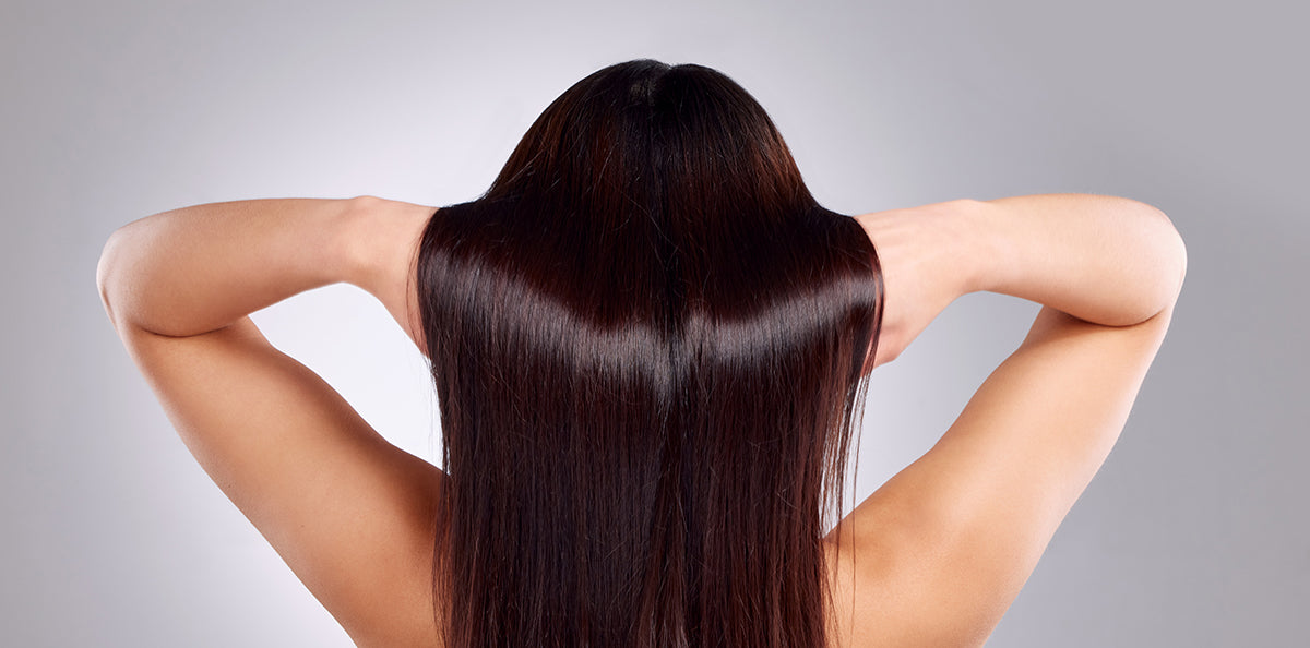 girl elevating her shiny long hair