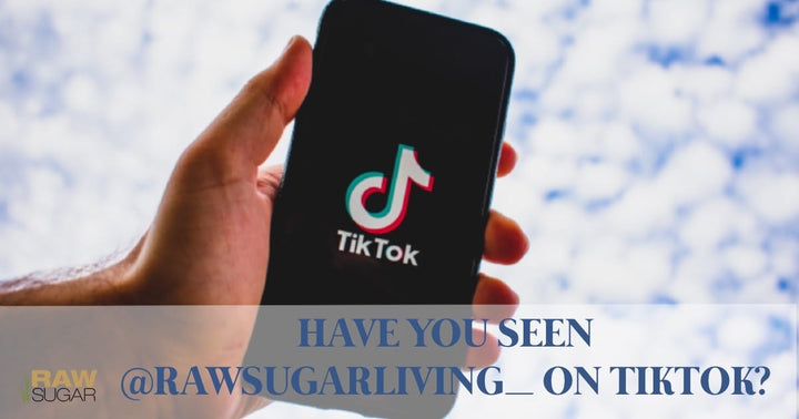 Have you Seen @RawSugarLiving_ on TikTok?  messaging over person holding phone with TikTok logo displayed. 