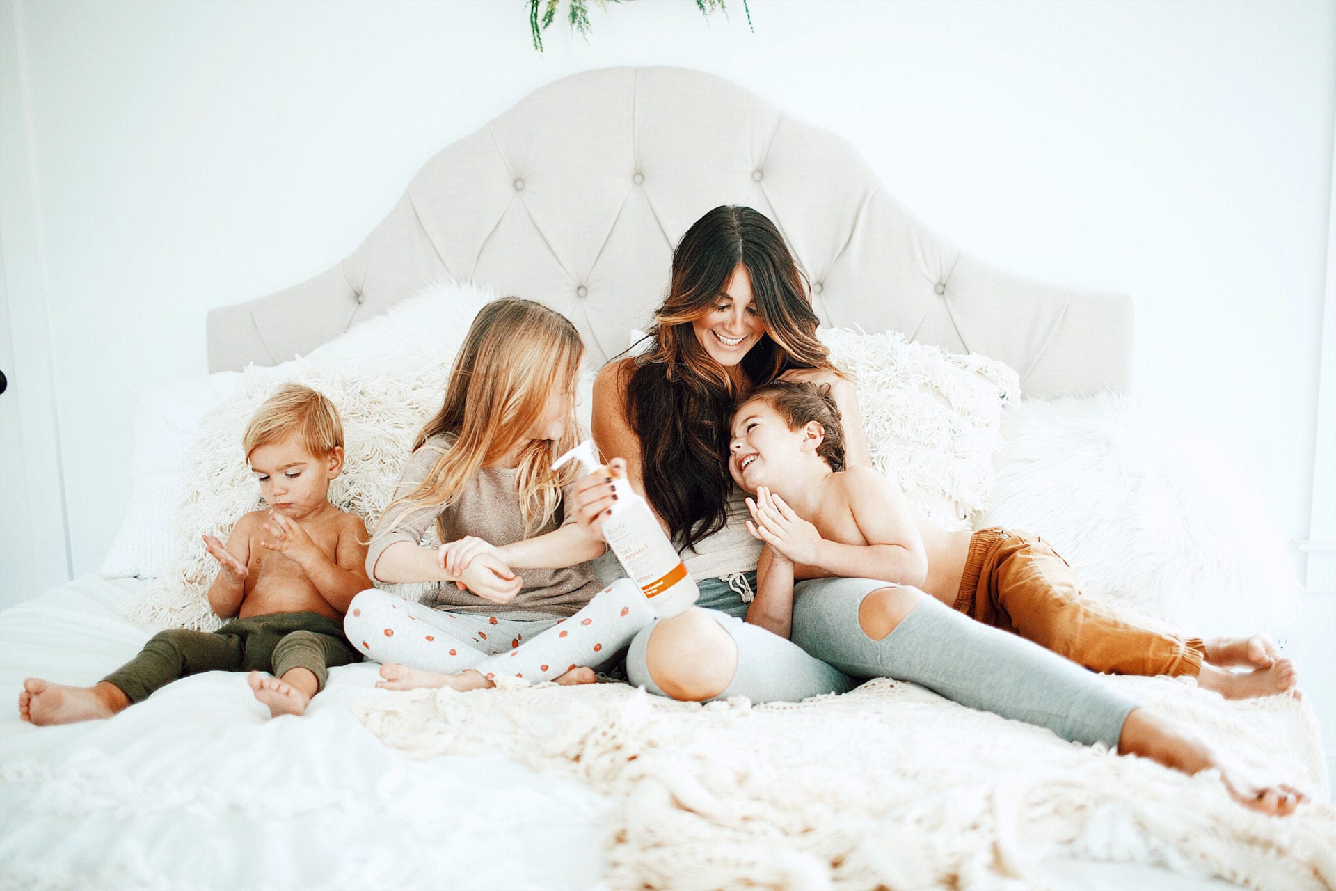 family in bed reading