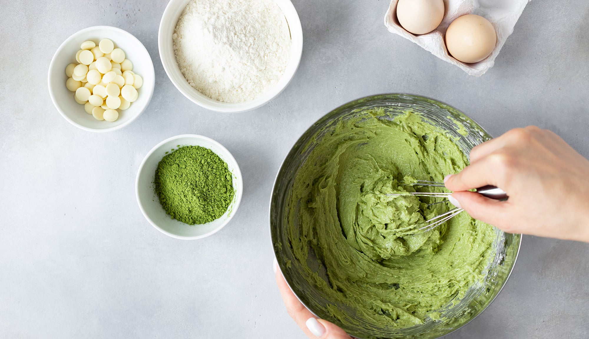 hand mixing matcha cookie dough