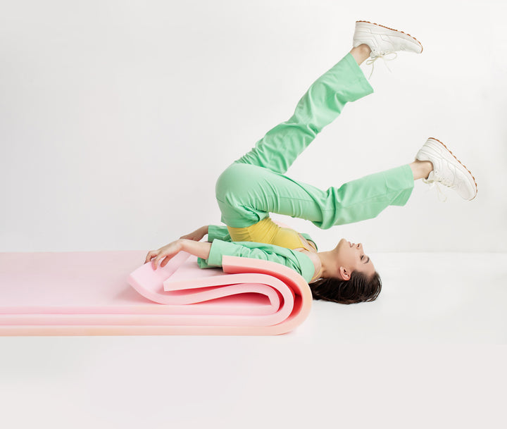 human stretching with yoga mats