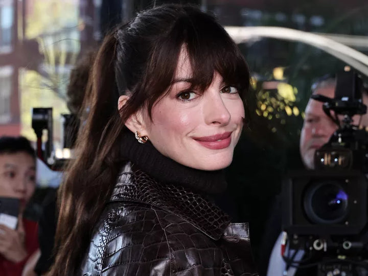 Anne Hathaway with bangs and pony tail