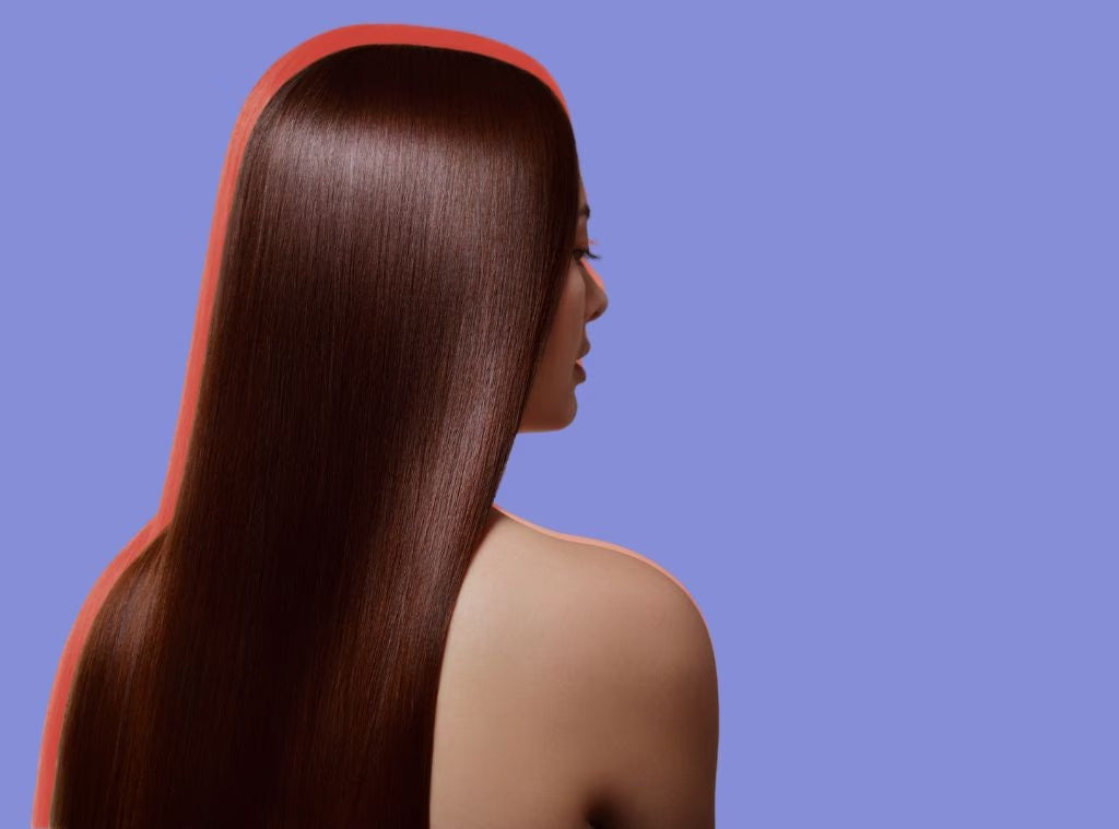 Girl in front of blue background with shiny hair and orange outline