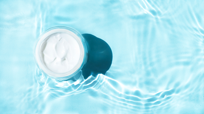 cream in jar on water