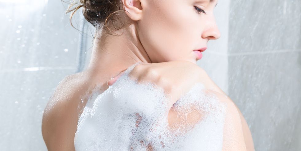 woman lathering in shower