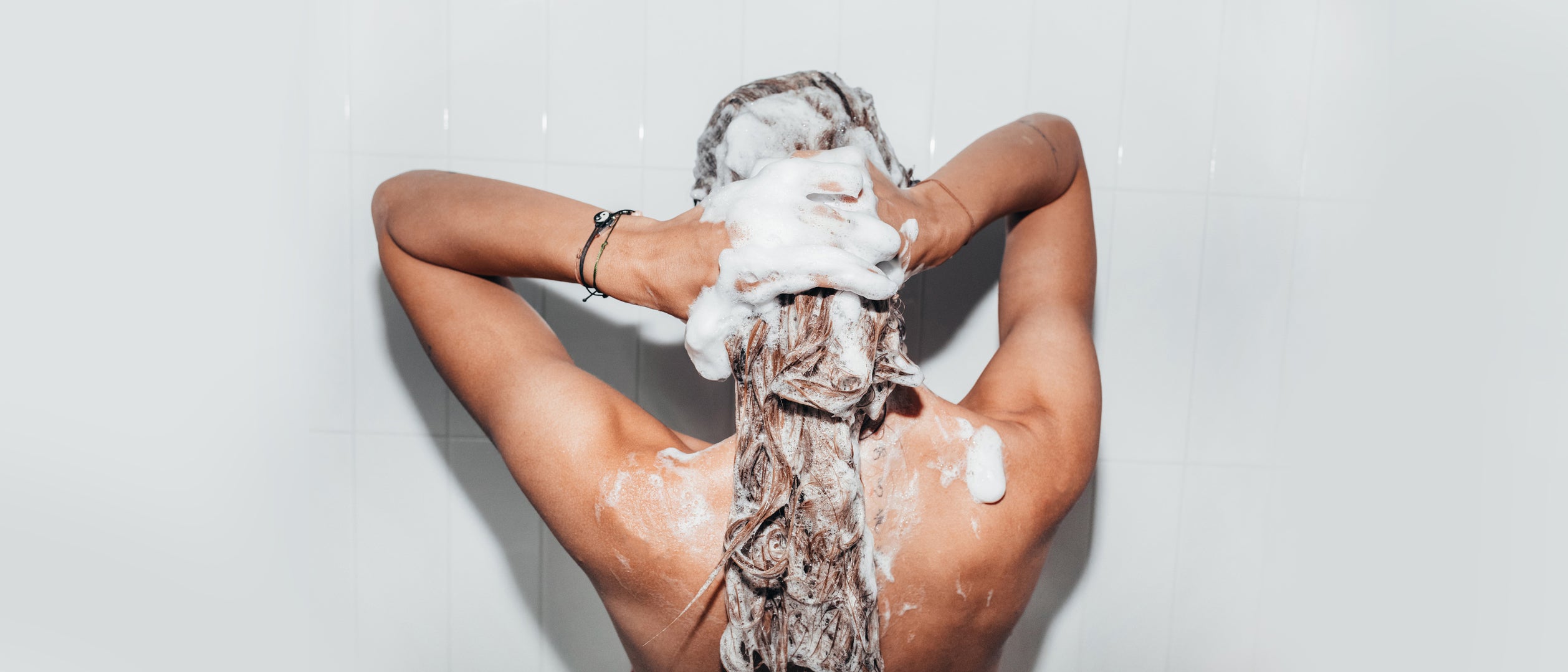 person washing their hair