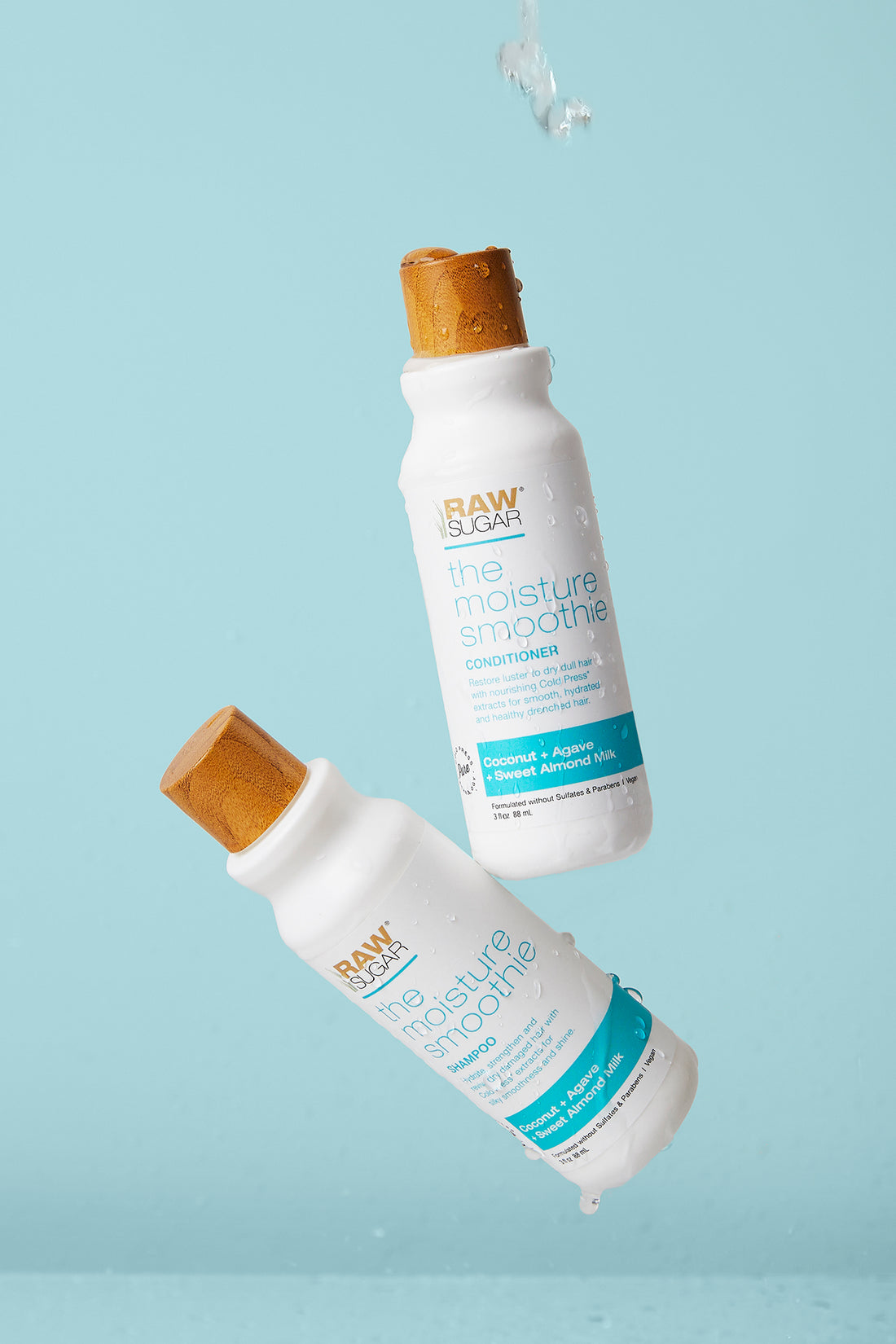 mini shampoo and conditioner floating in front of blue background