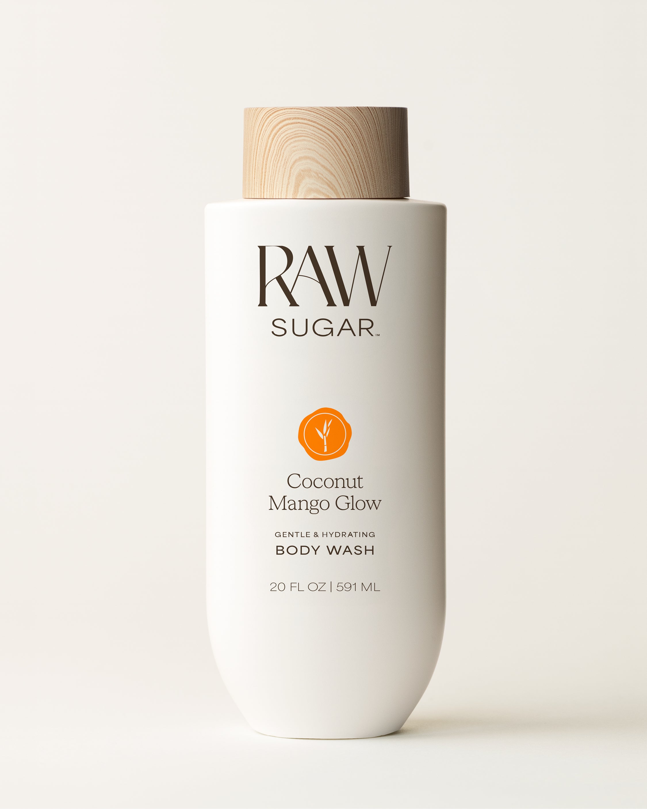 RAW Sugar Coconut Mango Glow body wash bottle on a white background