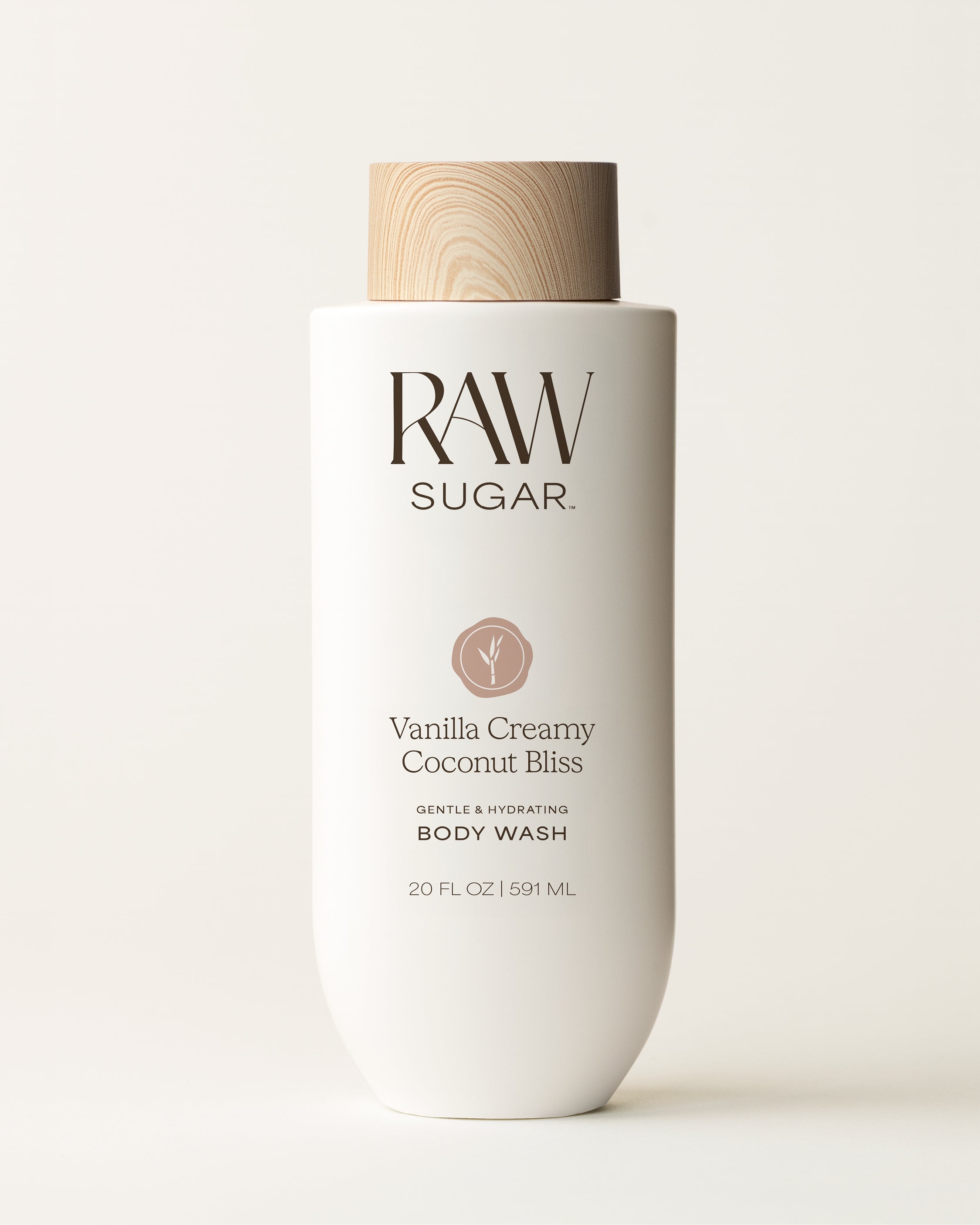RAW Sugar Vanilla Creamy Coconut Bliss body wash bottle on a white background