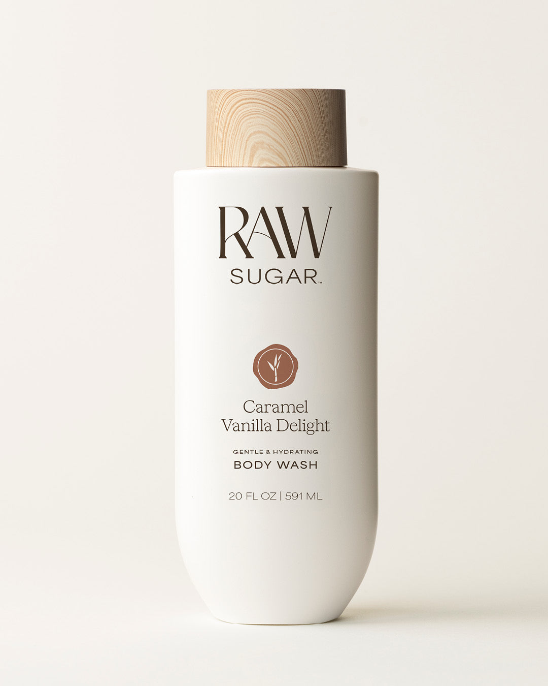 Bottle of Raw Sugar Vanilla Body Wash on a cream background, designed to help gently cleanse and hydrate skin with clean ingredients.