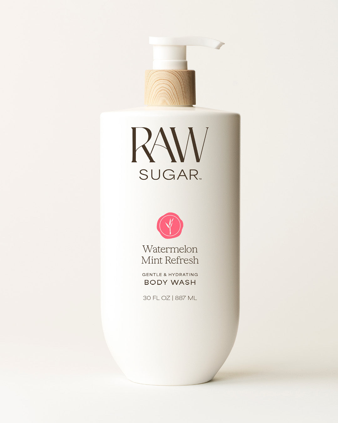 Bottle of Raw Sugar Watermelon Body Wash on a cream background, designed to help gently cleanse and hydrate skin with clean ingredients.