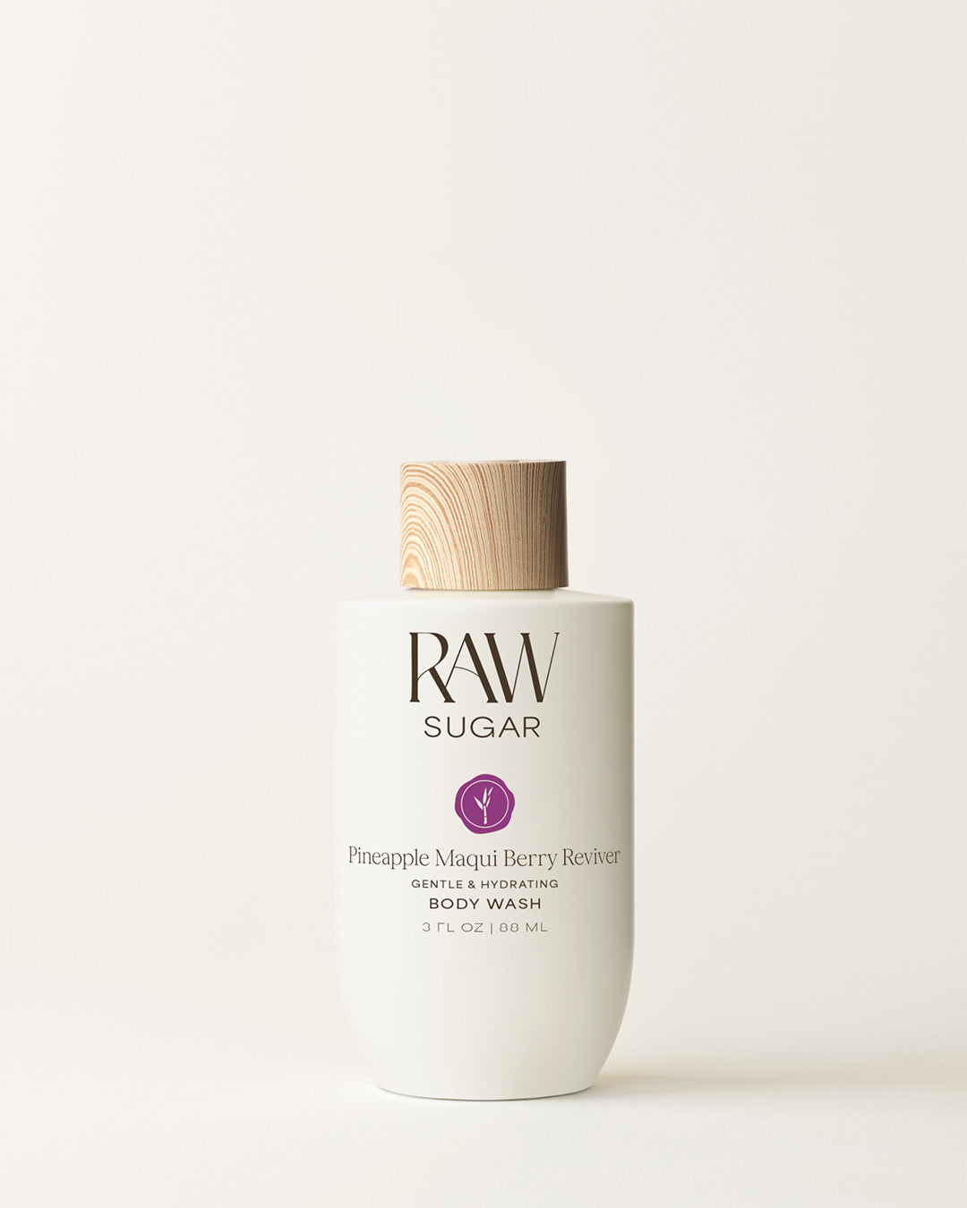 Bottle of Travel Raw Sugar Pineapple Body Wash on a cream background, designed to help gently cleanse and hydrate skin with clean ingredients.
